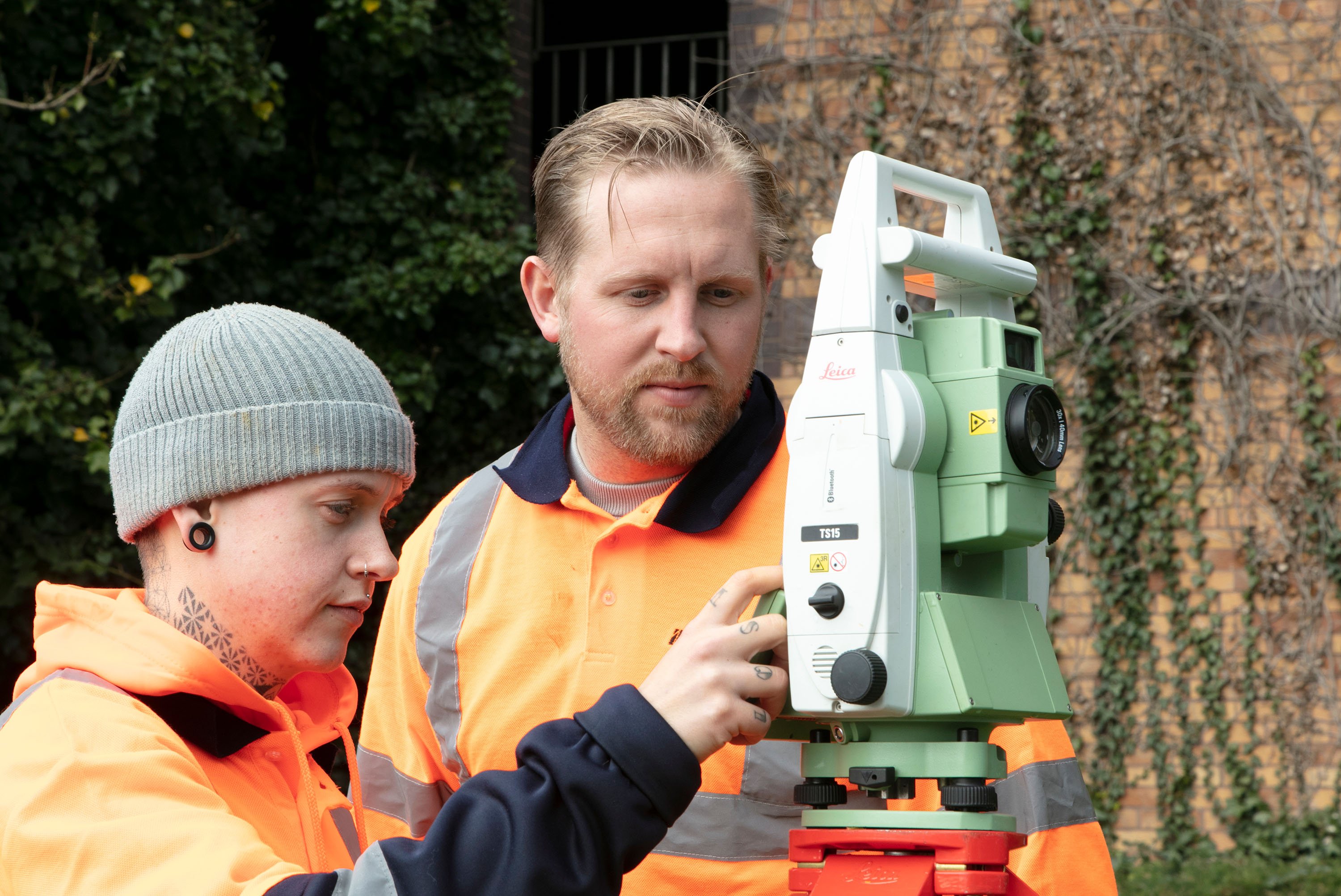 topographical surveys with workers in hi-vis