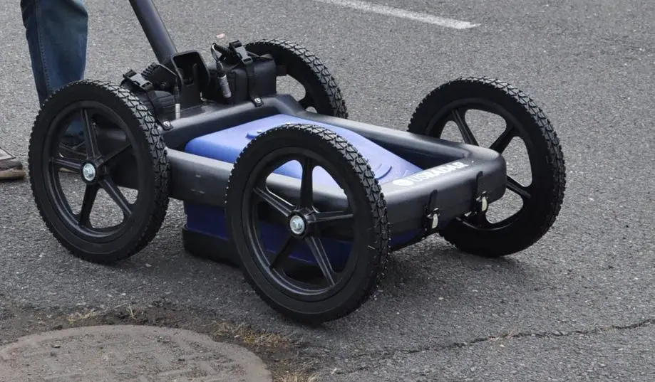 Ground Penetrating Radar (GPR) survey in progress, showing equipment used to detect underground utilities and structures.