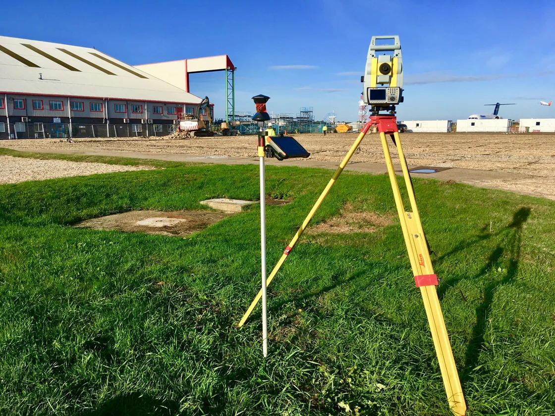 topographical survey equipment on grass